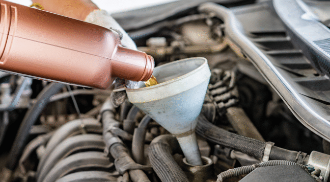 Fluid being poured into an engine