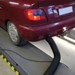 Car with equipment attached to the exhaust