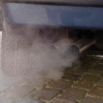 Car exhaust with visible fumes