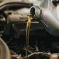 Oils being poured into an engine